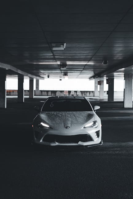 Luxury Cars - Stylish white sports car in a dimly lit undergro #17793005