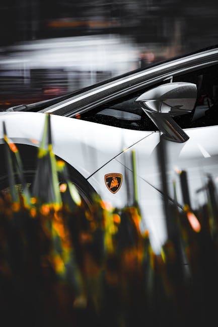 Luxury Cars - Stylish white sports car featuring a prominent l #20864107