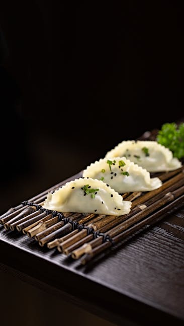 Food Aesthetics - Close-up of tasty Asian dumplings garnished with #27039846