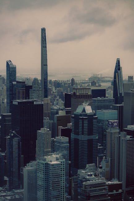 City Architecture - Dramatic view of Manhattan skyscrapers under an  #29906771