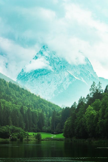 Mountain Landscapes - Serene view of a misty mountain rising above lus #30567606