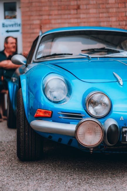 Luxury Cars - A classic blue sports car with a striking front  #33285093