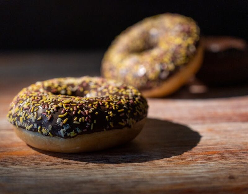 Food Aesthetics - Close-up of chocolate glazed doughnuts with colo #34168753