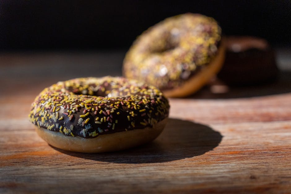 Food Aesthetics - Close-up of chocolate glazed doughnuts with colo #34168753
