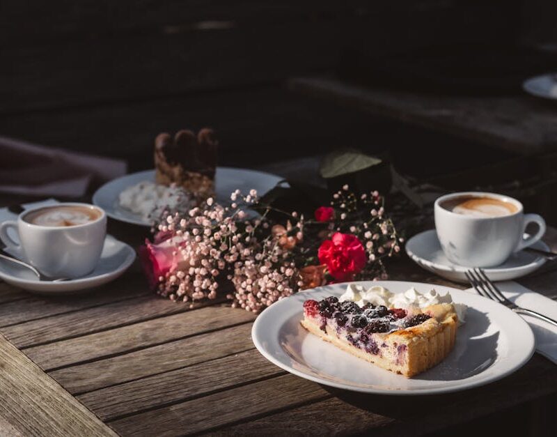 Food Aesthetics - A warm, inviting outdoor setup with coffee, berr #35121849