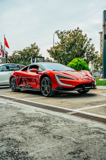 Luxury Cars - Eye-catching red sports car parked outdoors in a #35252973