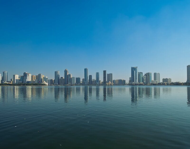City Architecture - Panoramic view of Sharjah skyline reflecting on  #35471381