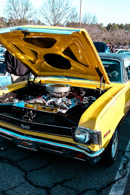 Luxury Cars - Vibrant yellow vintage muscle car with hood open #35528207