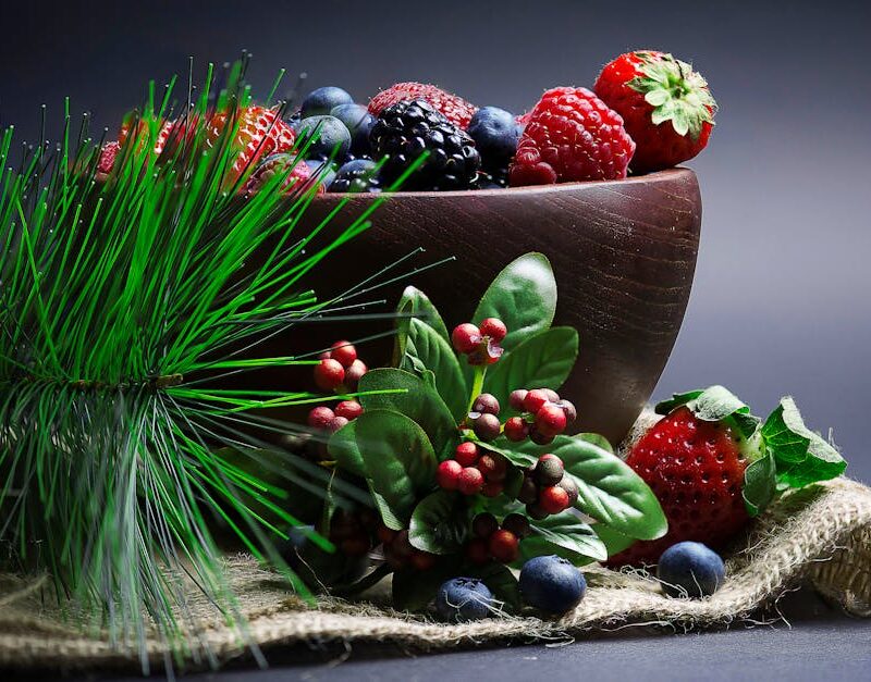 Food Aesthetics - A colorful assortment of berries in a wooden bow #3628829