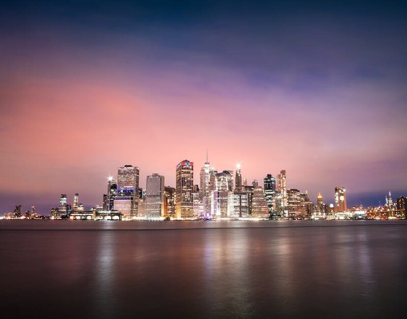 City Architecture - Magnificent remote view of illuminated skyscrape #5890834