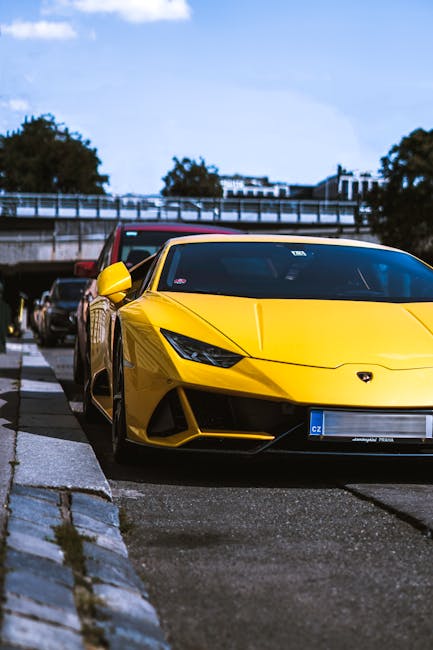 Luxury Cars - A vibrant yellow Lamborghini hypercar parked out #6957588