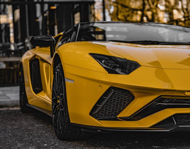Luxury Cars - Close-up of a yellow Lamborghini Aventador parke #7391663